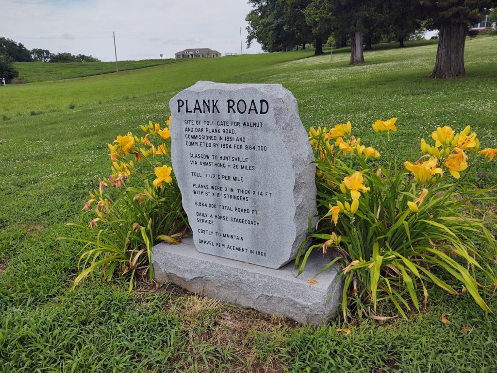 Plank Road Marker sits to the side of Randolph Street preceding the driveway to Harrison House, the second stop on the driving tour.